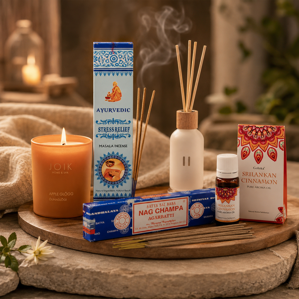 Aromatherapy products with Nag Champa incense sticks, Sri Lankan cinnamon aroma oil, diffuser reeds and scented candle