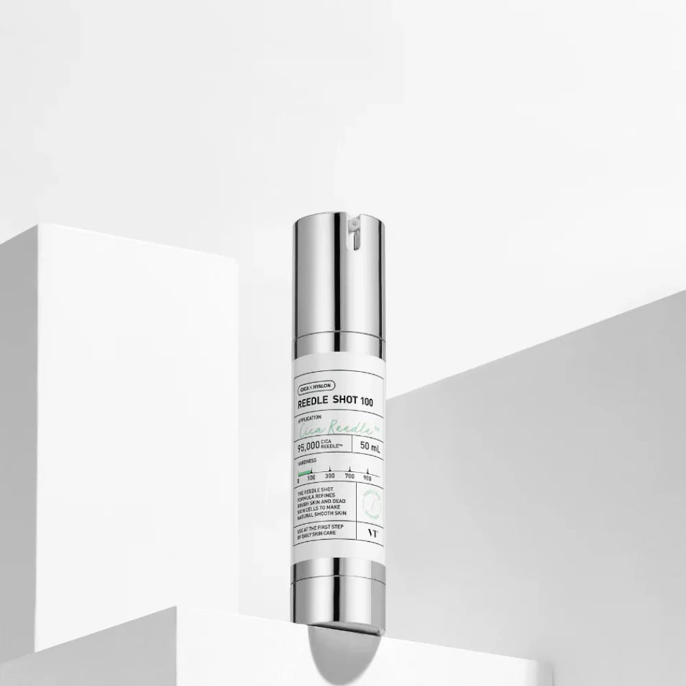 Skincare serum bottle with silver cap on a white background