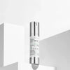 Skincare serum bottle with silver cap on a white background