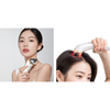 Two images of a woman using a hair care device on her head.