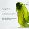 Glass of water with green seaweed and text about key ingredients on a white background