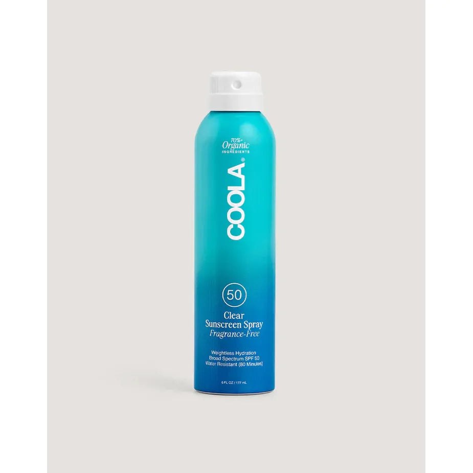 A bottle of COOLA Body Continuous Spray with SPF 50, labeled as fragrance-free, organic, and reef-safe.