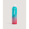 A bottle of COOLA Body Continuous Spray with Guava-Mango SPF 50, featuring a blue and pink color gradient design.