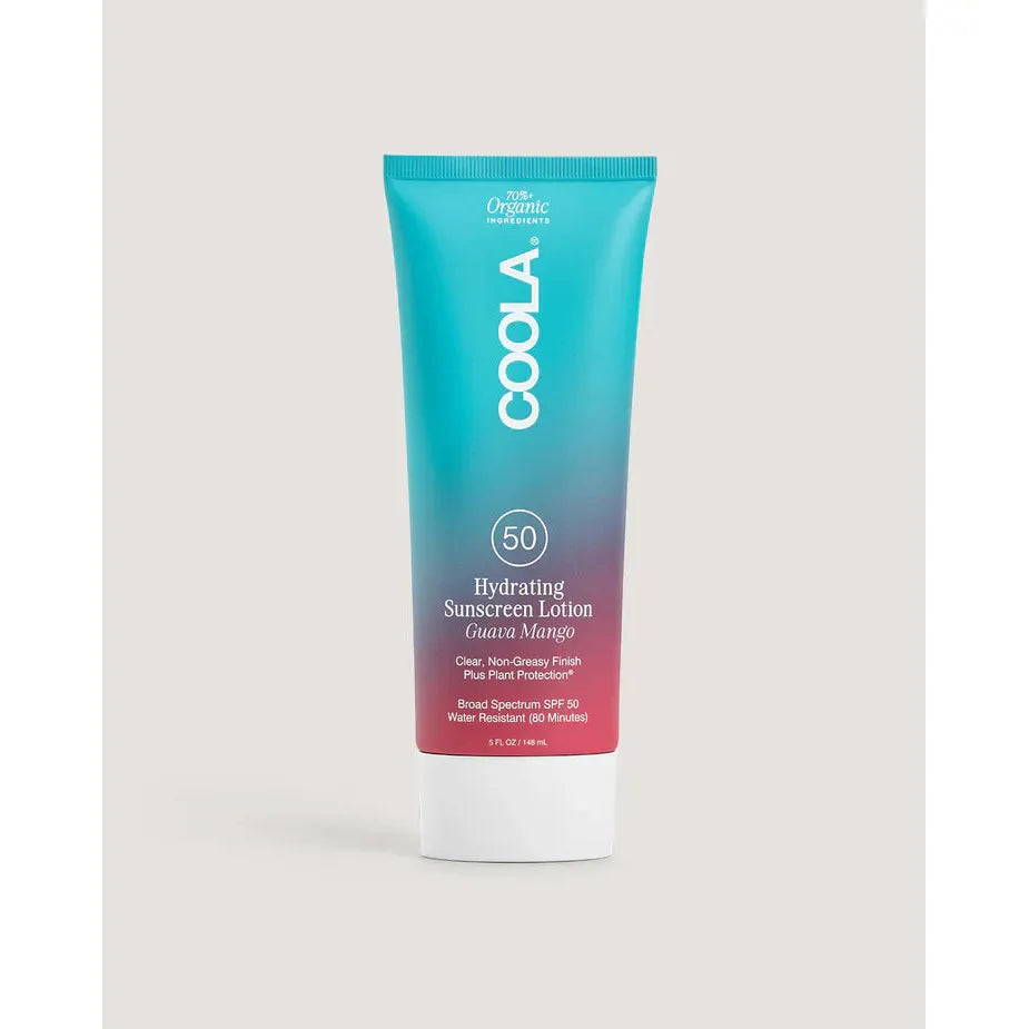 Coola sunscreen lotion tube on a light gray background