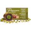 Milk chocolate covered date with pistachio and Natures Own Factory packaging on a white background