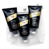 A travel set of DSD de Luxe hair care products including shampoo, hair mask, and hair serum, packaged in black tubes with gold and white accents, displayed in front of a gray background.