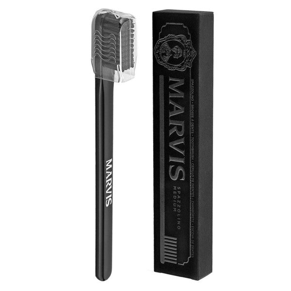 Marvis black toothbrush with matching bristles and protective travel cover