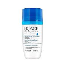 Uriage Deodorant Douceur in a white roll-on bottle with a blue cap, labeled in French.