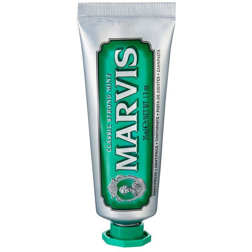 A tube of Marvis Classic Strong Mint toothpaste with a green label and white branding text.